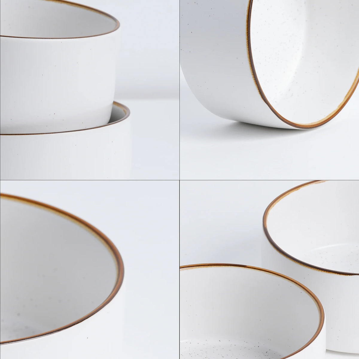 Set of white ceramic bowls with gold rims on a light gray background
