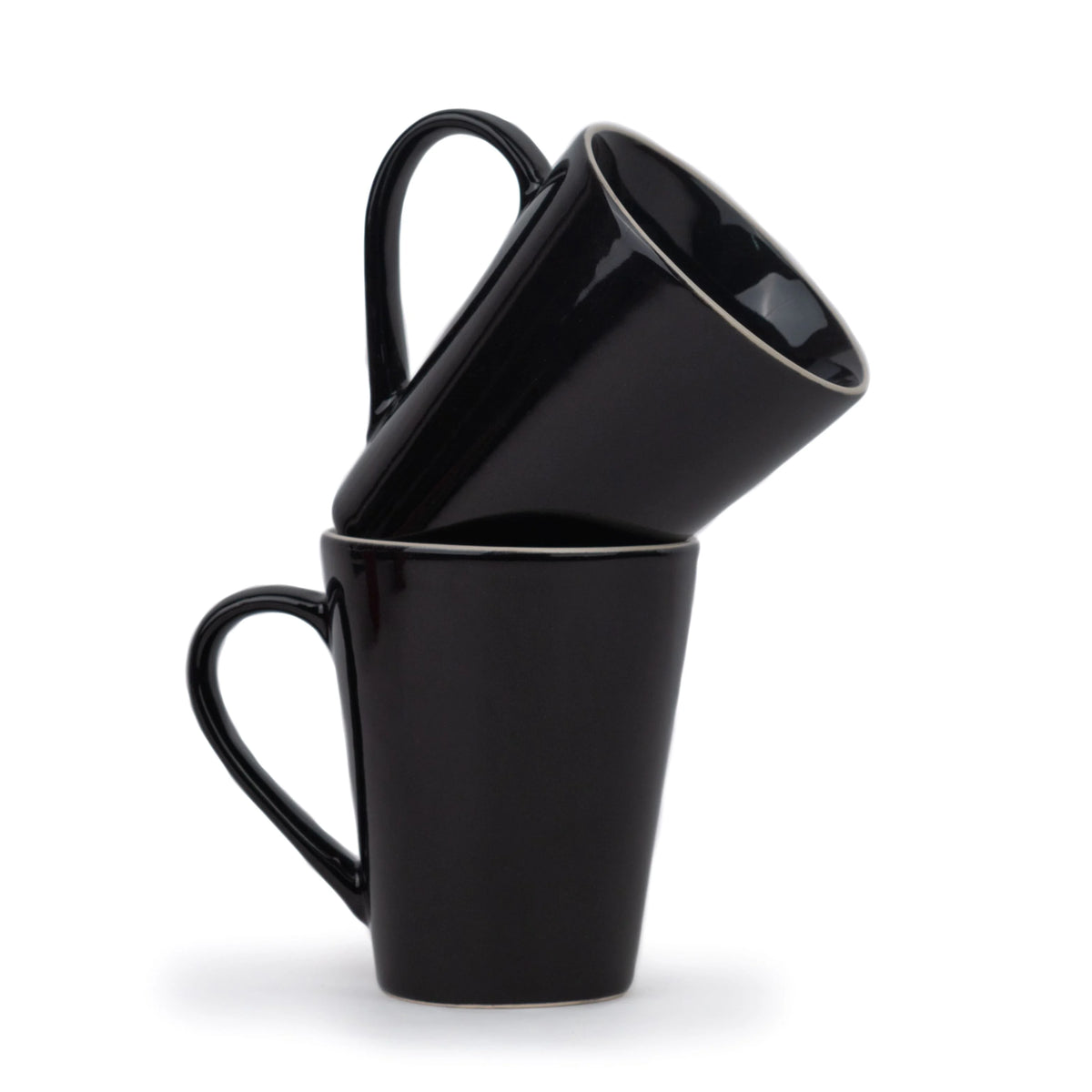 Three black mugs stacked on top of each other against a white background