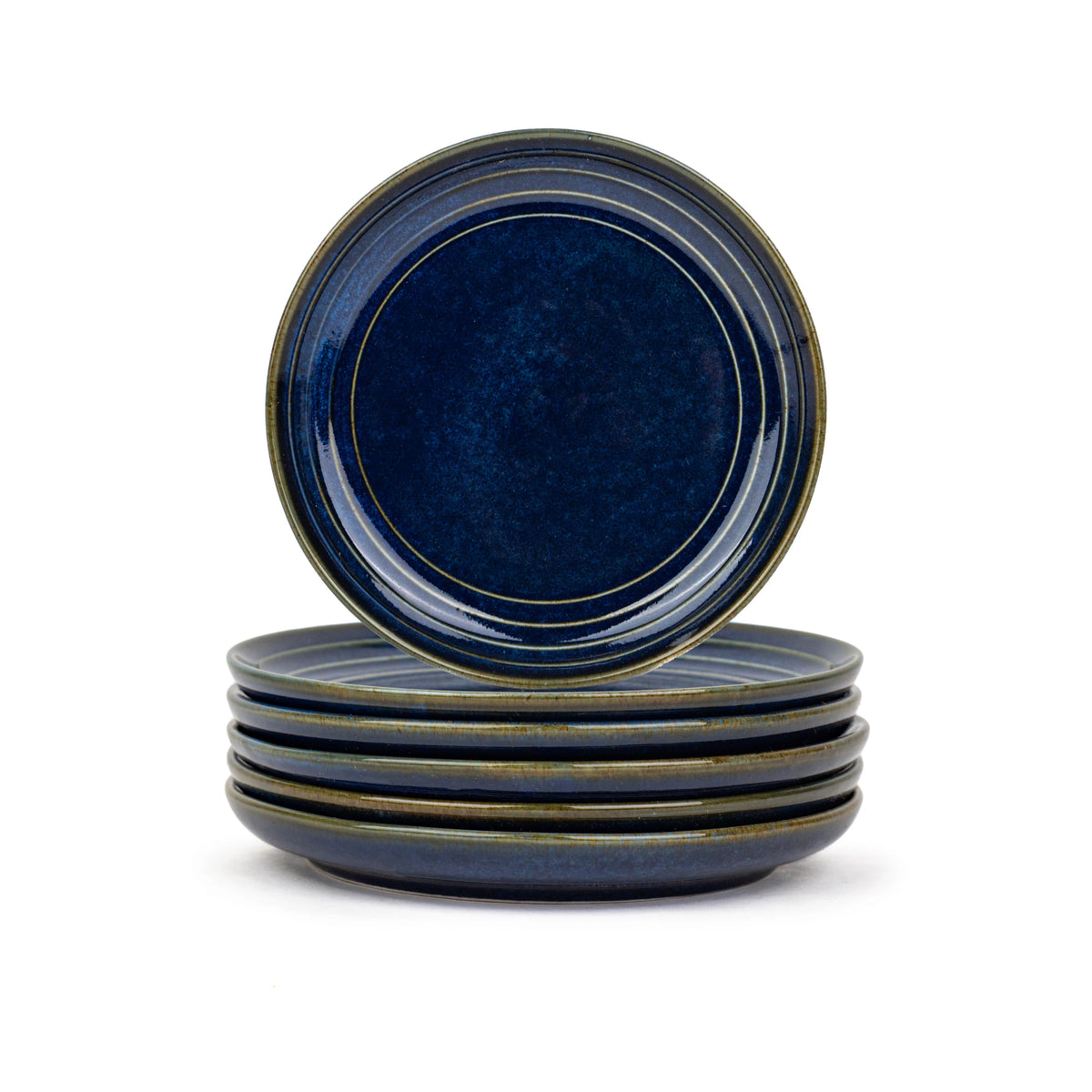 Set of four blue ceramic plates with a white background