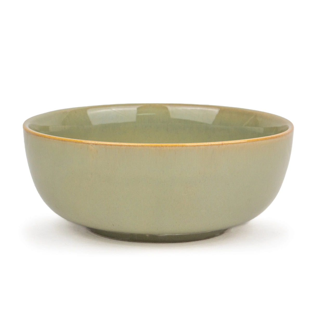 Green ceramic bowl on a white background
