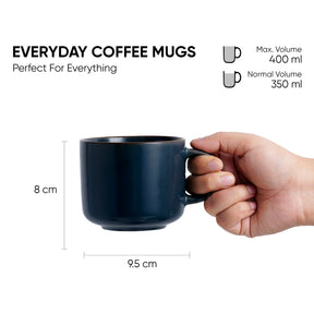 Black coffee mug held by a hand with measurements and volume details on a white background