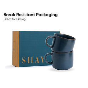Two blue mugs stacked on top of each other with a 'SHAY' branded box in the background.