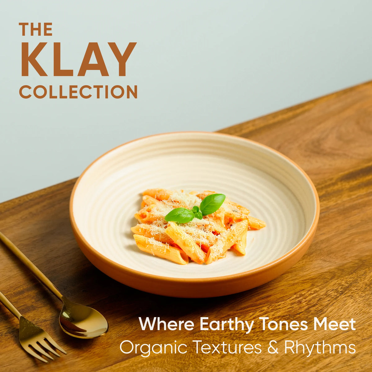 Dish of pasta with a wooden background and 'The Klay Collection' branding.