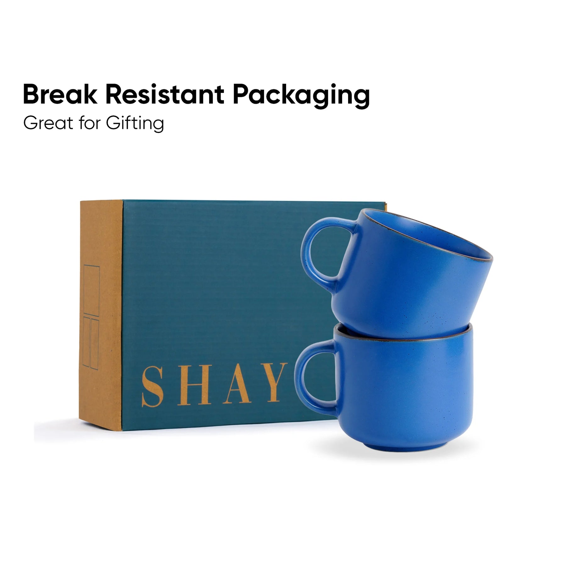 Blue mugs stacked in front of a 'SHAY' branded box with text about break-resistant packaging.