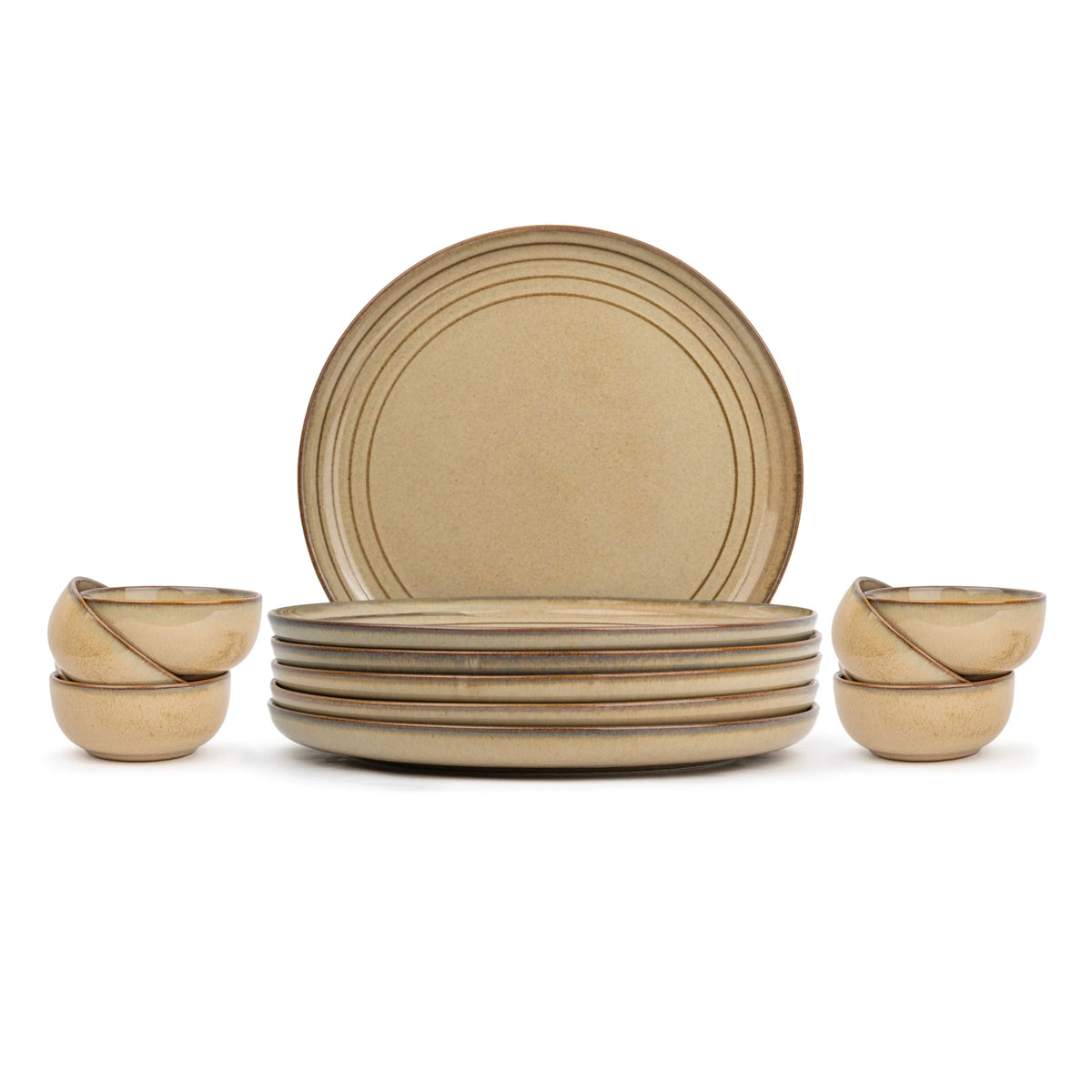 Set of beige ceramic plates and bowls on a white background