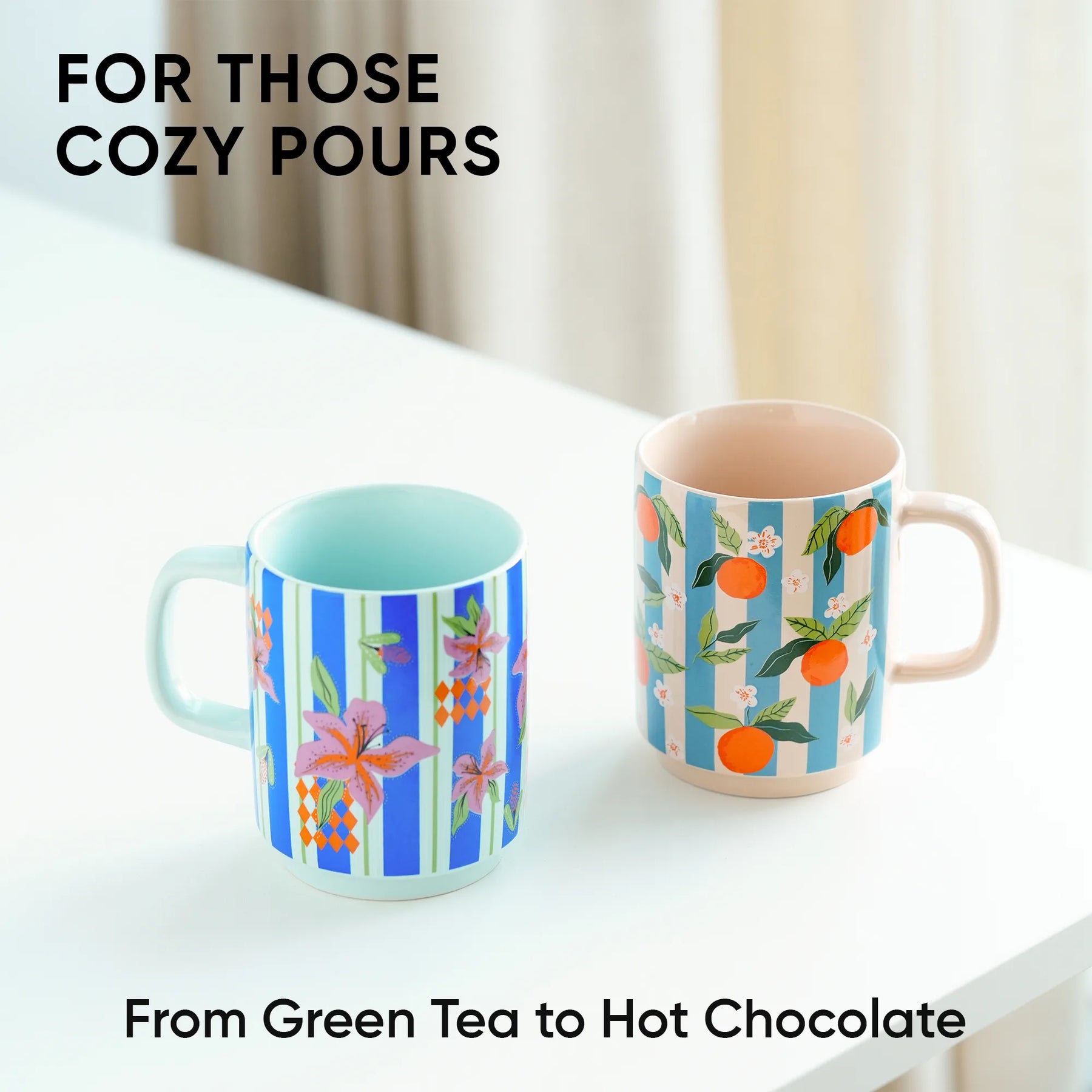 Two patterned mugs on a white surface with text about cozy pours.
