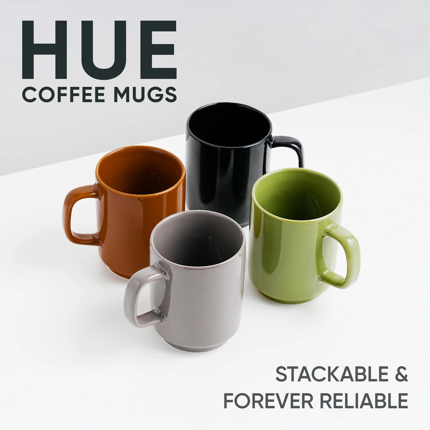 Four colorful coffee mugs on a white surface with 'HUE' branding.