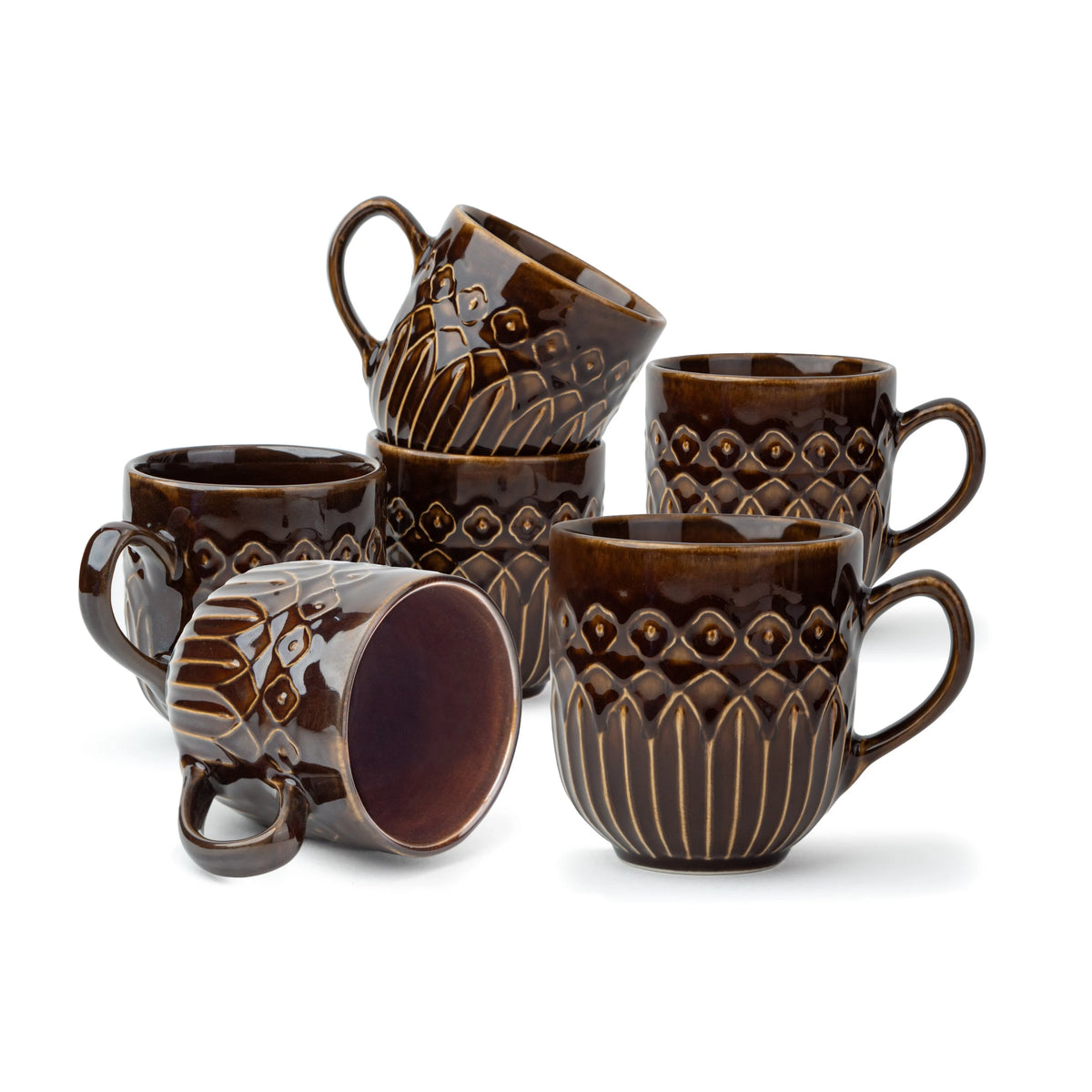 Set of brown ceramic mugs with embossed designs on a white background