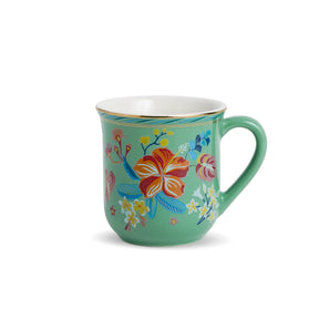 Green mug with floral design on a white background