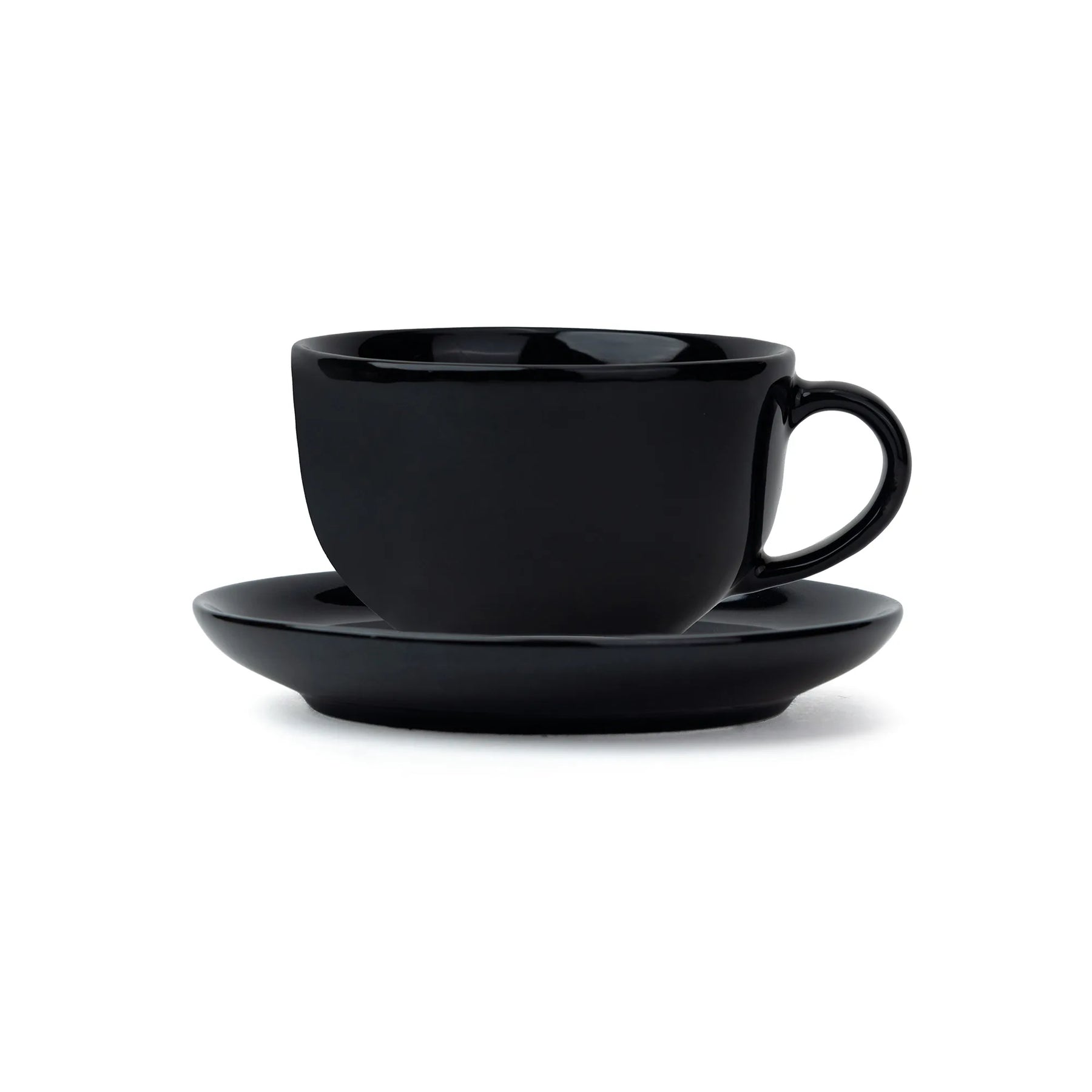 Black ceramic cup and saucer set on a white background