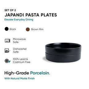 Set of 2 Japandi pasta plates with black body and brown rim on a white background.