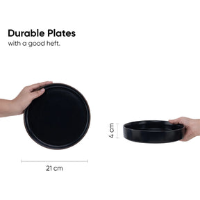 Two black plates held by hands with measurements on a white background