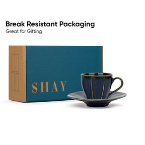 Ceramic cup and saucer with 'SHAY' branded box on a white background
