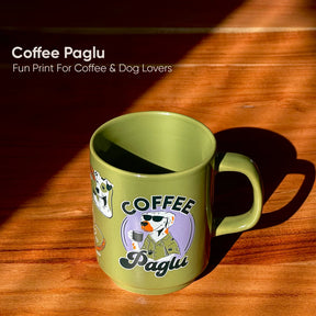 Green mug with 'Coffee Paglu' design on a wooden surface