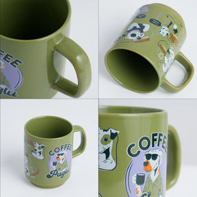 Green mug with cartoon dog design and 'Coffee Pagle' text on a white background