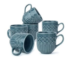 Set of five blue ceramic mugs with decorative patterns on a white background