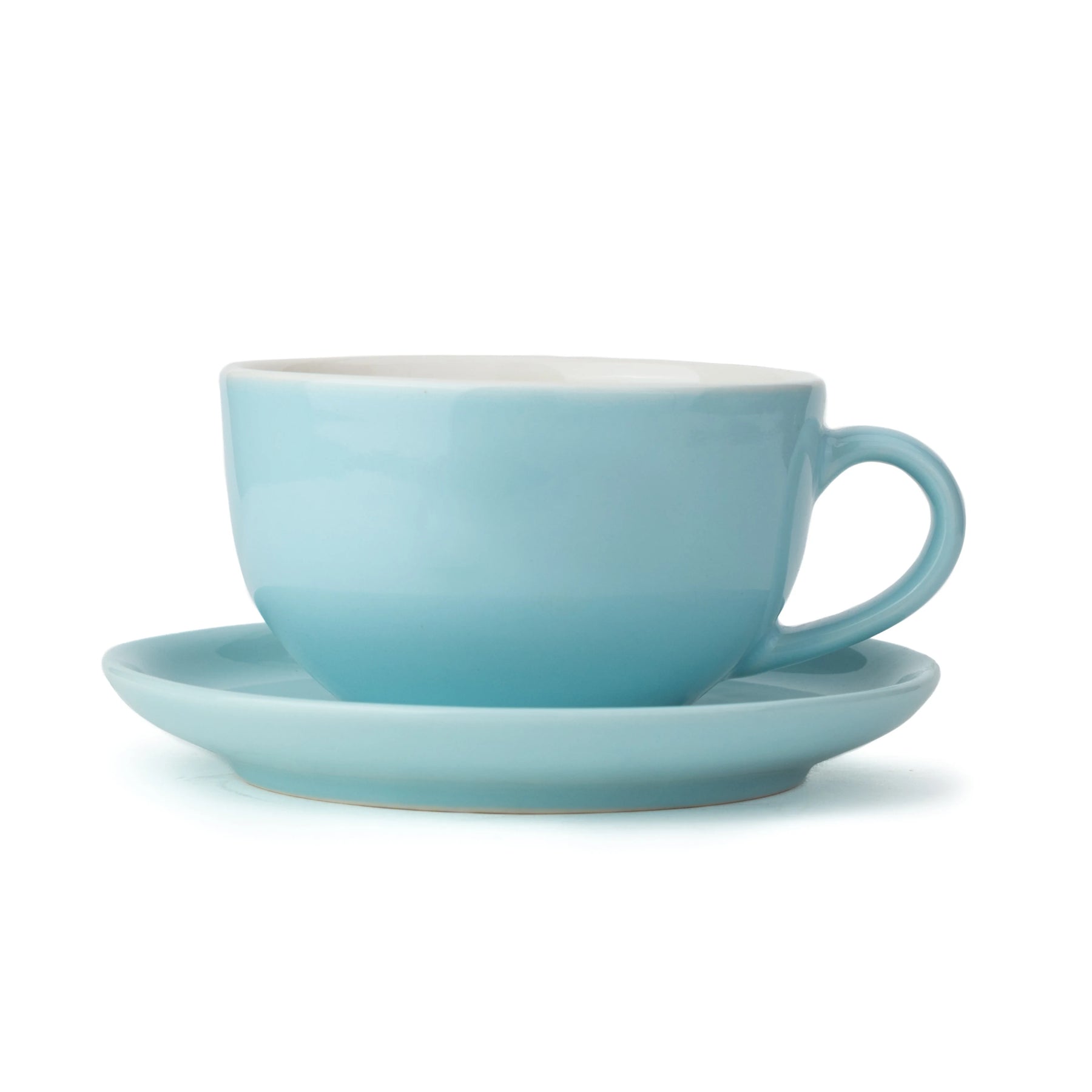 Light blue cup and saucer set on a white background