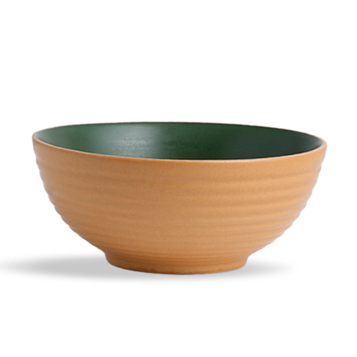 Bowl with green interior and brown exterior on a white background
