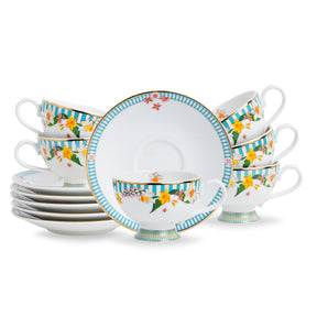 Ceramic tea set with floral and striped design on a white background