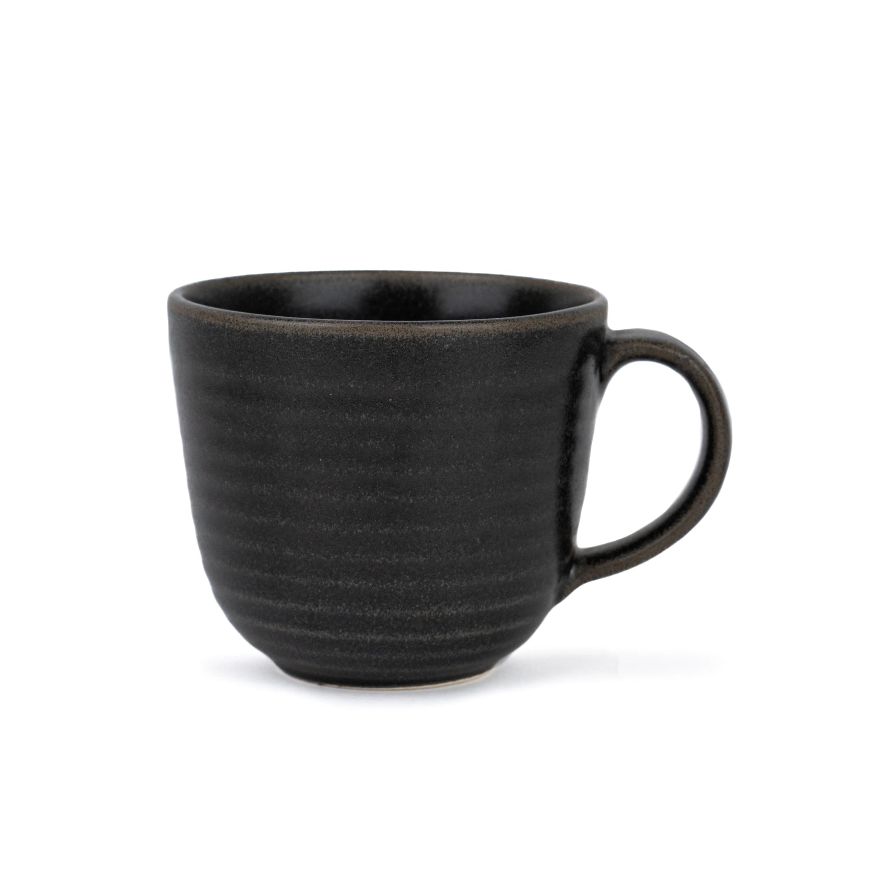 Black ceramic mug on a white background
