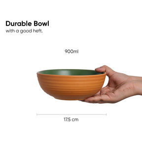 Hand holding a durable bowl with dimensions and capacity information on a white background
