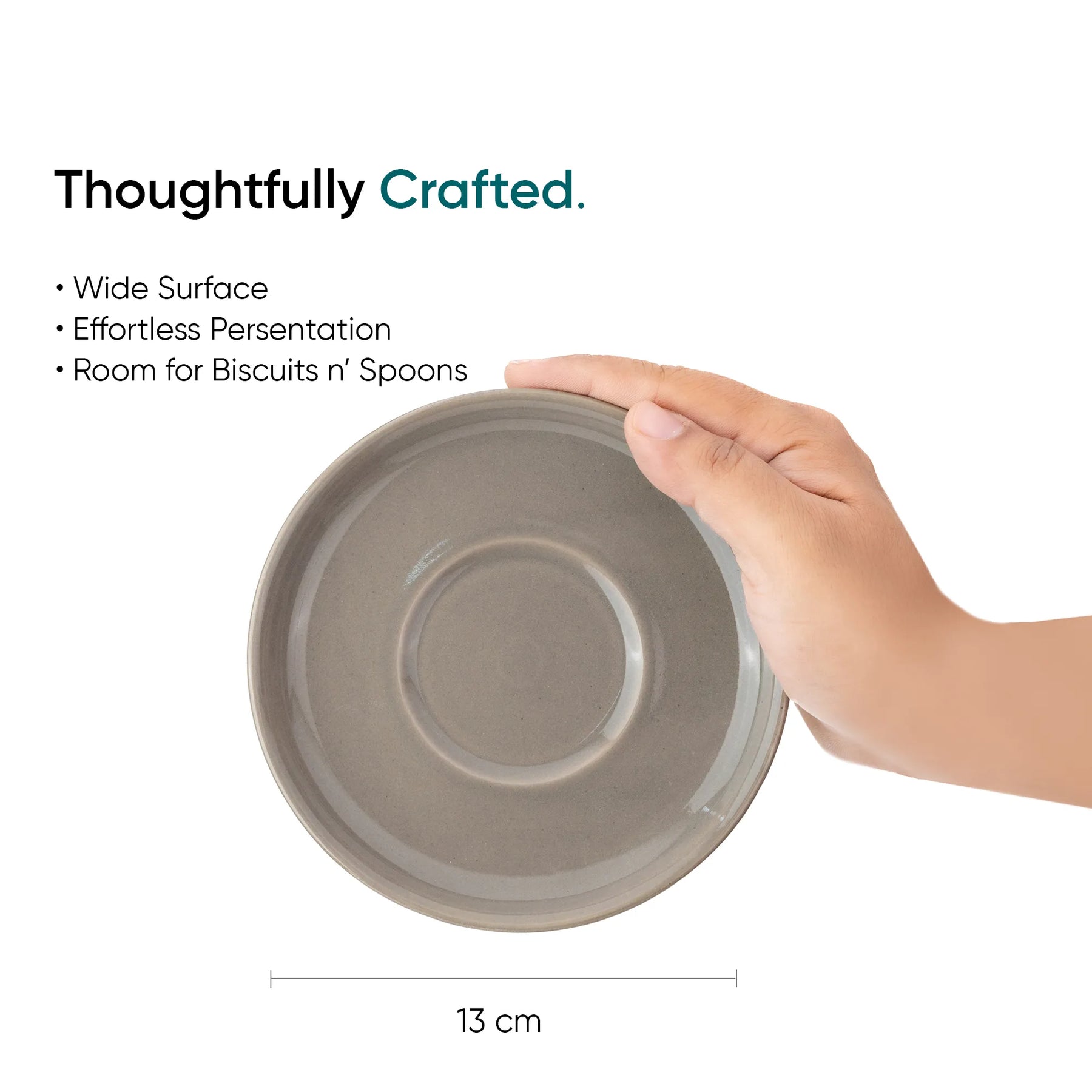 Hand holding a gray ceramic plate with text highlighting features on a white background