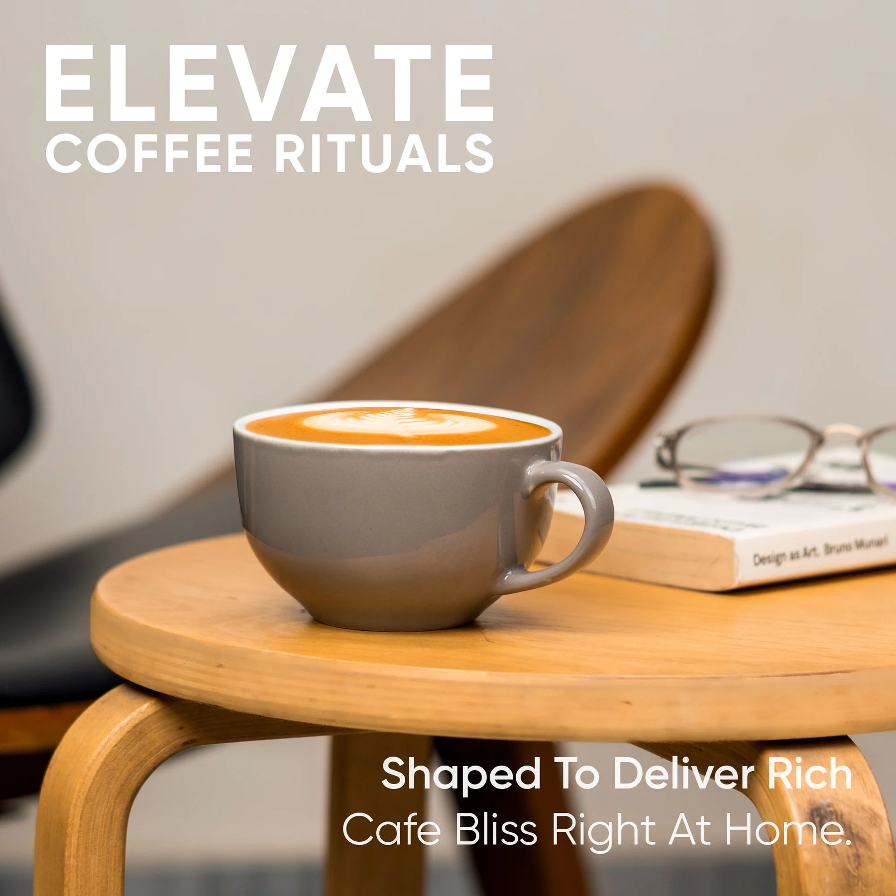 Cup of coffee on a wooden table with a book and glasses, featuring 'Elevate Coffee Rituals' text.