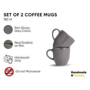 Set of 2 gray coffee mugs with gold rim, shown with product details on a white background.