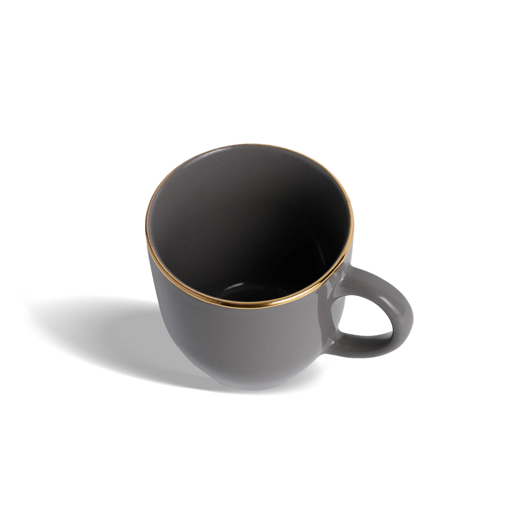 Gray mug with gold rim on a white background