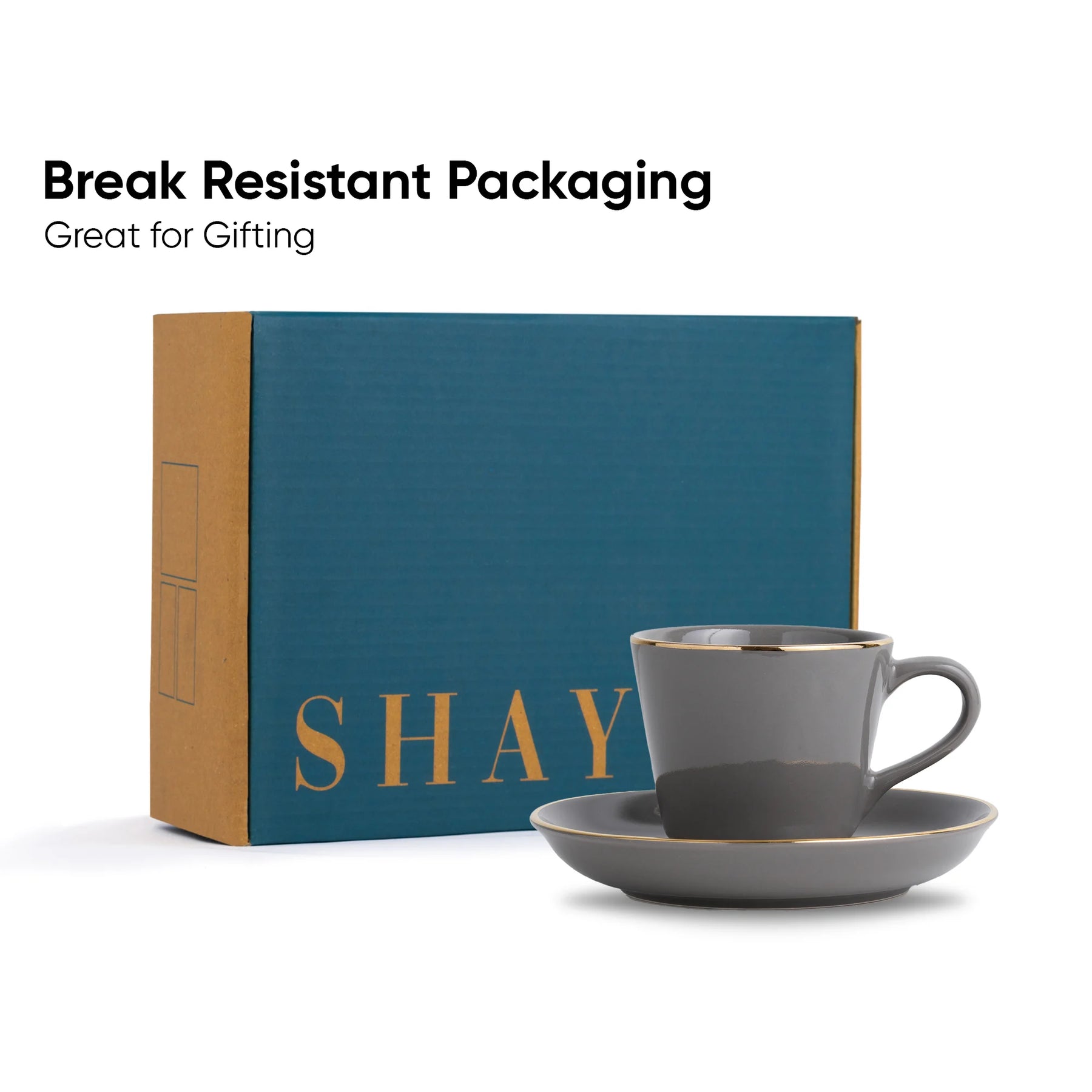 Gray mug and saucer set with 'SHAY' branding on a blue box, labeled 'Break Resistant Packaging'.