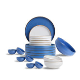 Ceramic dinnerware set with blue and white design on a white background