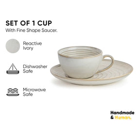 Ceramic cup and saucer set with 'Handmade & Human' branding on a white background