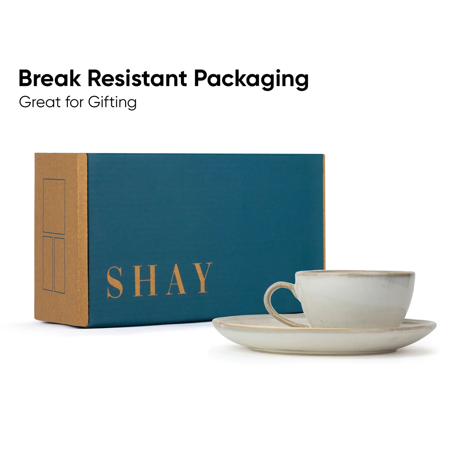 Ceramic cup and saucer with 'SHAY' branded box on a white background