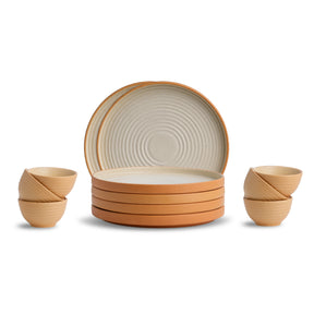 Set of ceramic plates and bowls with a textured design on a white background