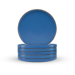 Set of blue plates with brown rim on a white background