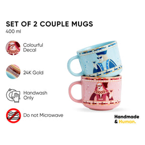 Set of 2 couple mugs with colorful decal and 24K gold details, on a white background.