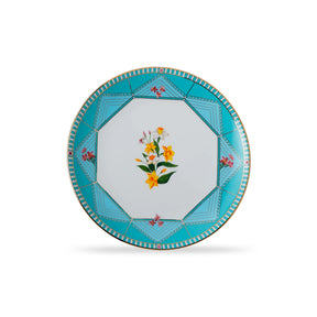 Decorative plate with floral design and blue border on a white background