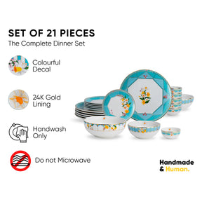 Set of 21 dinner pieces with colorful decal and 24K gold lining on a white background.