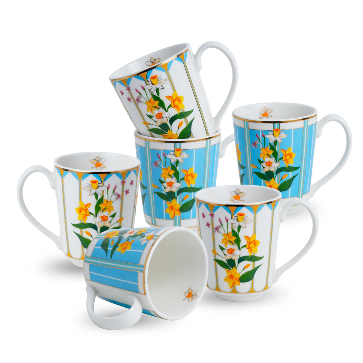 Set of floral and striped mugs on a white background