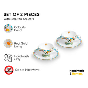 Set of 2 tea cups with saucers featuring colorful decal and real gold lining on a white background.