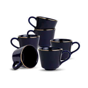 Set of six navy blue mugs with gold rims on a white background