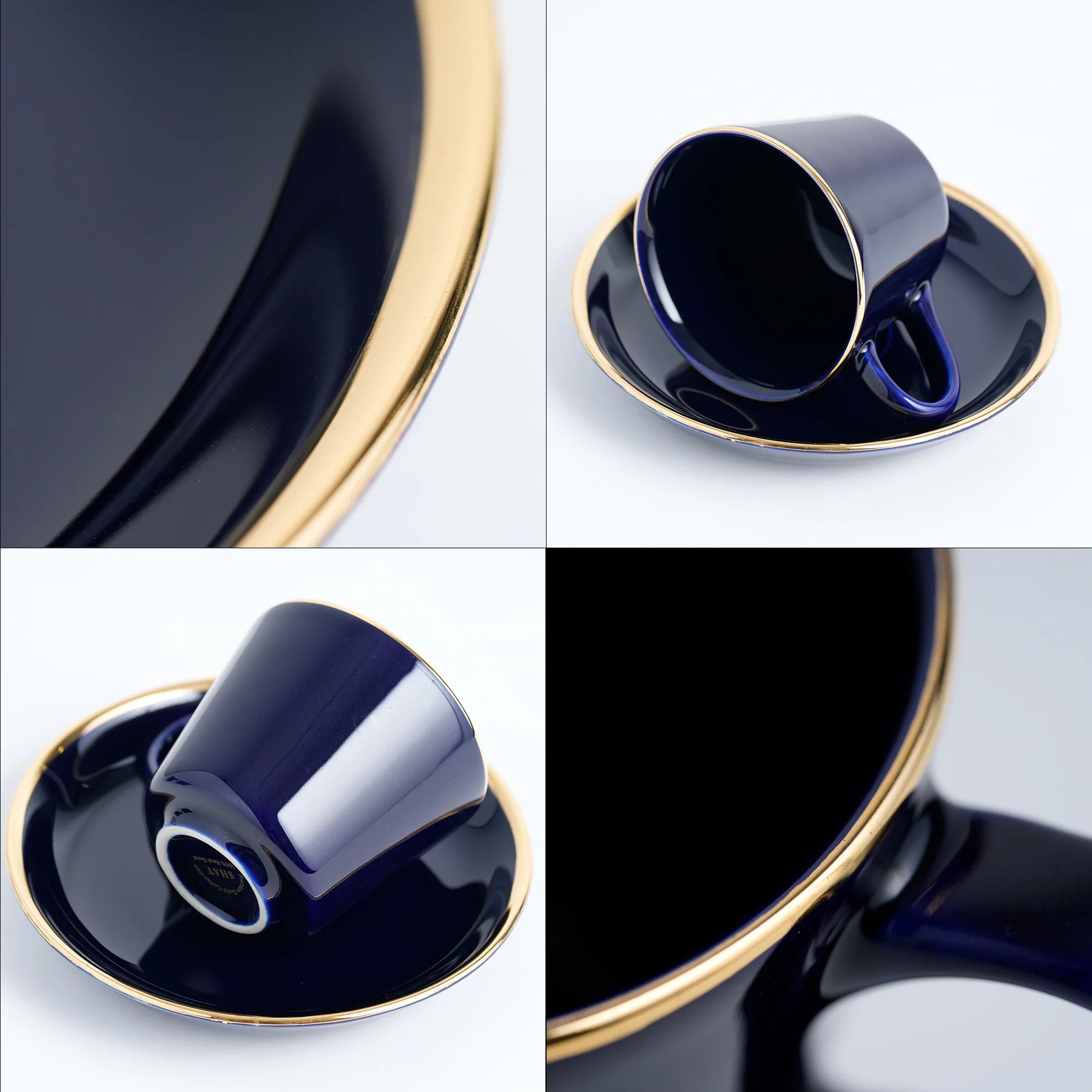Navy blue ceramic cup and saucer with gold trim on a white background