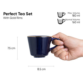 Navy blue mug with gold rims held by a hand, showing dimensions and volume details on a white background.