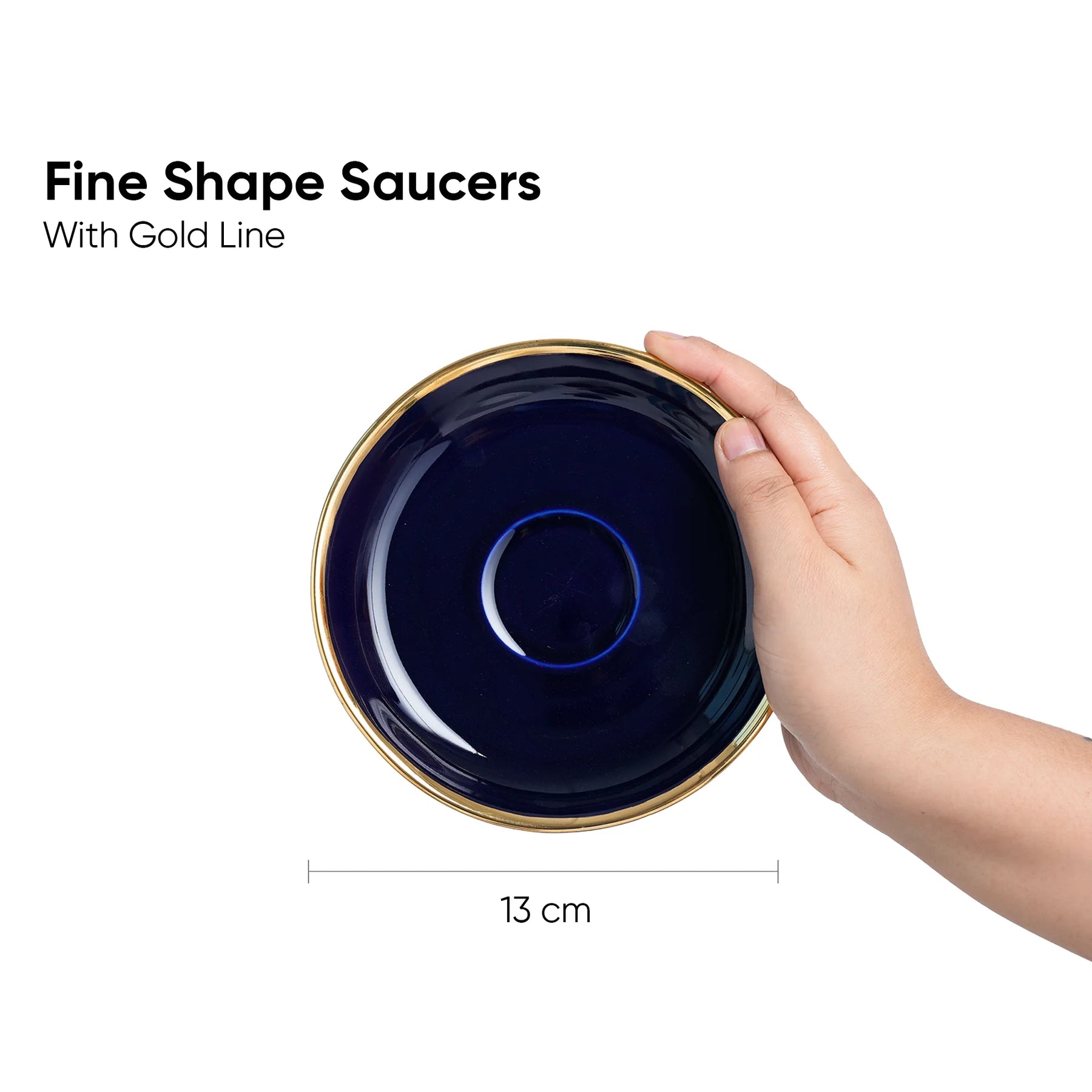 Navy blue saucer with gold rim held by a hand, dimensions indicated.
