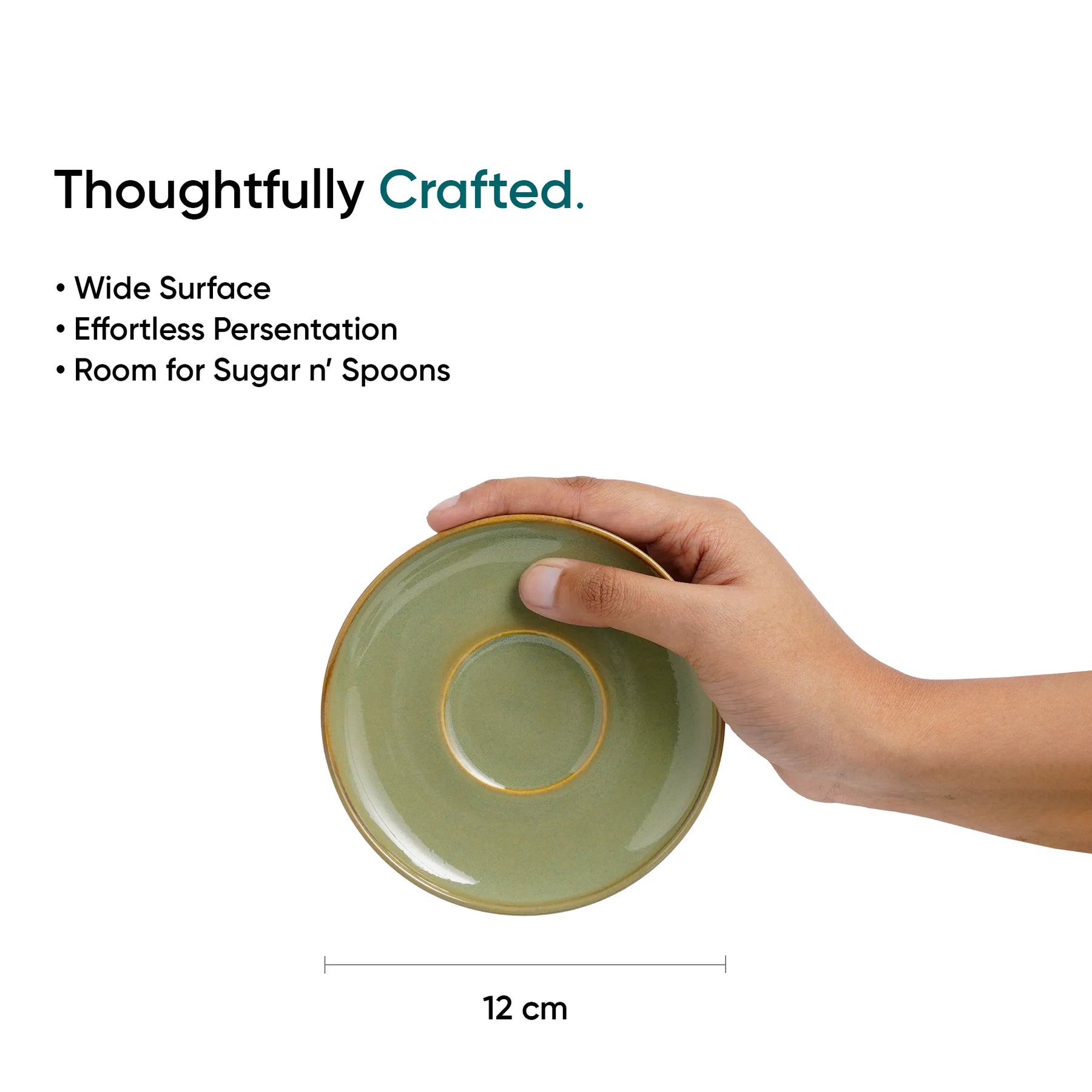 Hand holding a green ceramic dish with text about its features on a white background