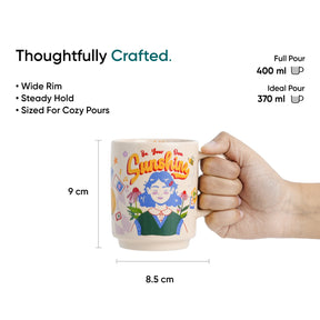 Mug with a design and text 'Be Your Own Sunshine' held by a hand, with measurements and product details on a white background.