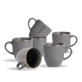 Set of gray mugs with gold rims on a white background