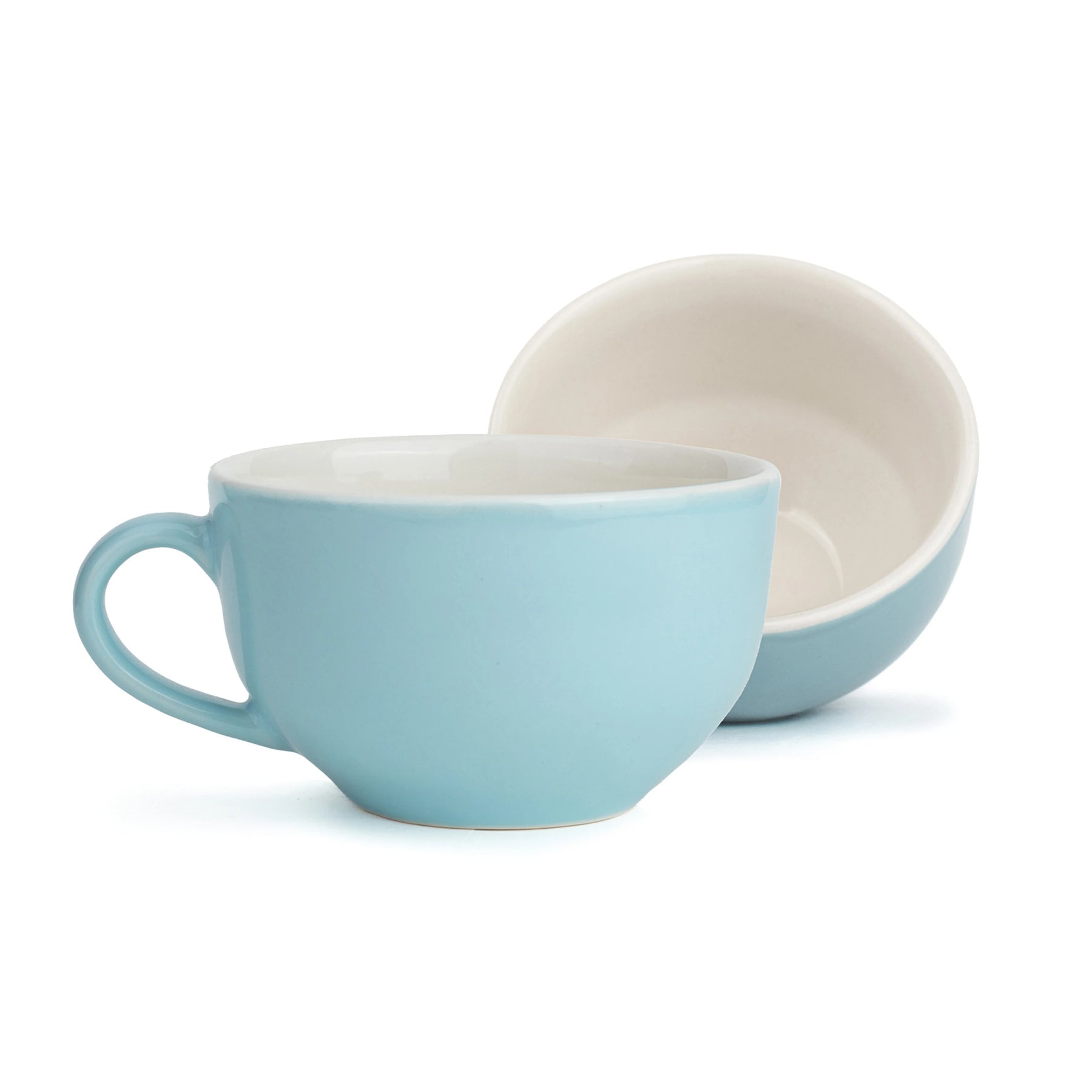 Two ceramic bowls, one light blue and one beige, on a white background