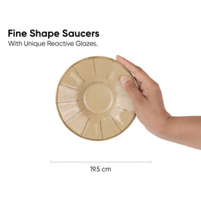 Hand holding a ceramic saucer with text about unique reactive glazes