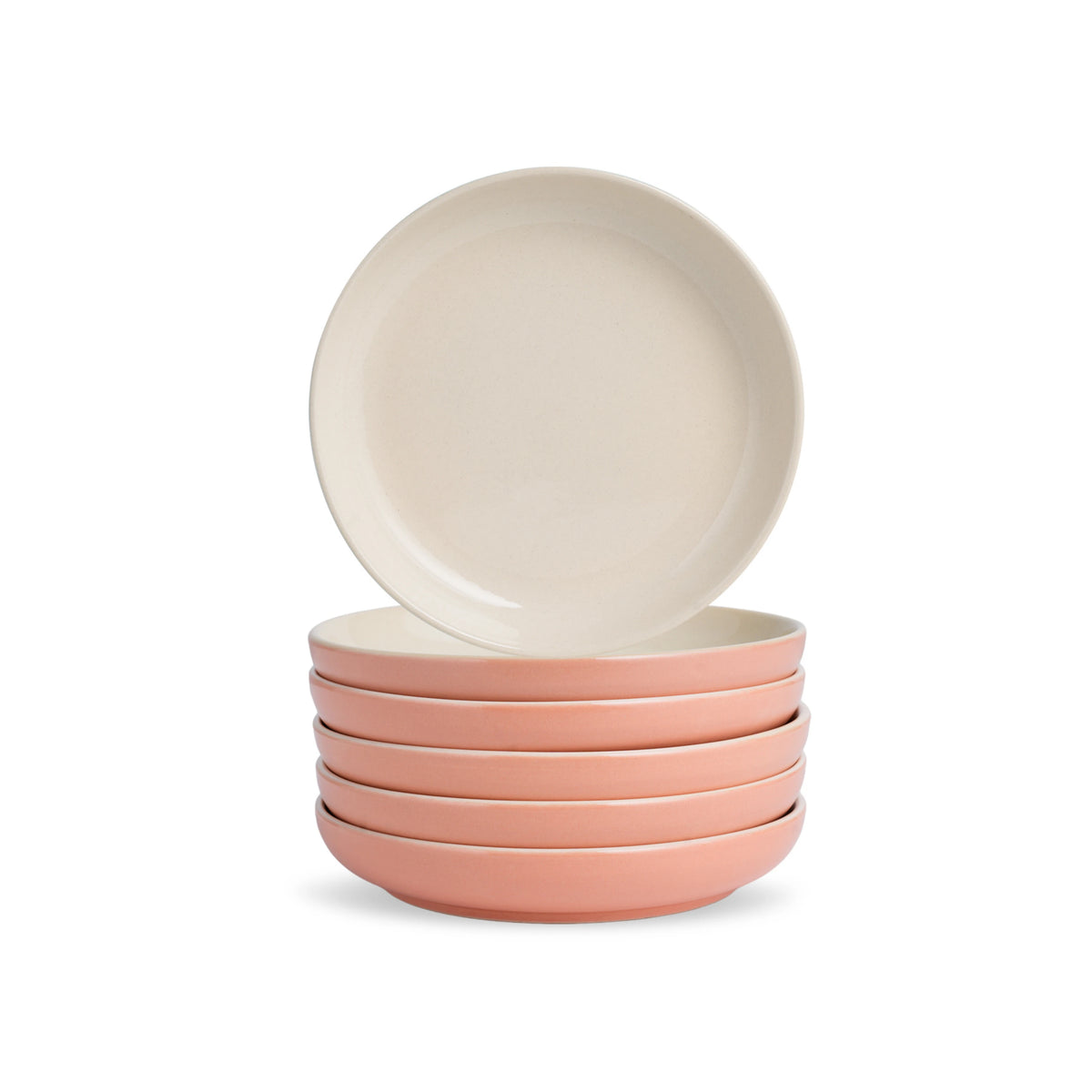 Set of four ceramic bowls in pink and beige on a white background